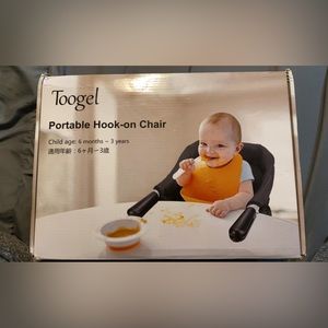 Portable hook on high chair. Hasn’t been opened.